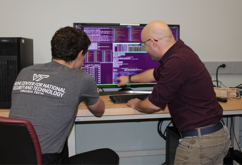 Virginia Tech researchers on Northop Grumman’s Securing Compartmented Information with Smart Radio Systems (SCISRS) program identifying anomalous signals. Photo by Isabella Rossi for Virginia Tech.